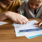 Sister playing word search with her little brother