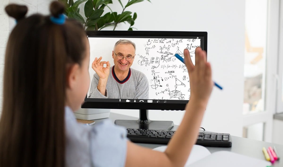 A schoolgirl studying homework-math online with her tutor at ATTC Education.